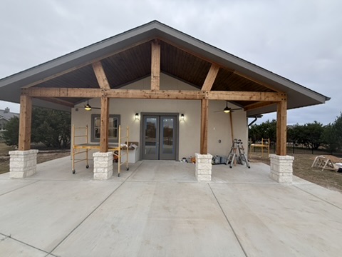 Timber pavilion posts set on finished stone column bases